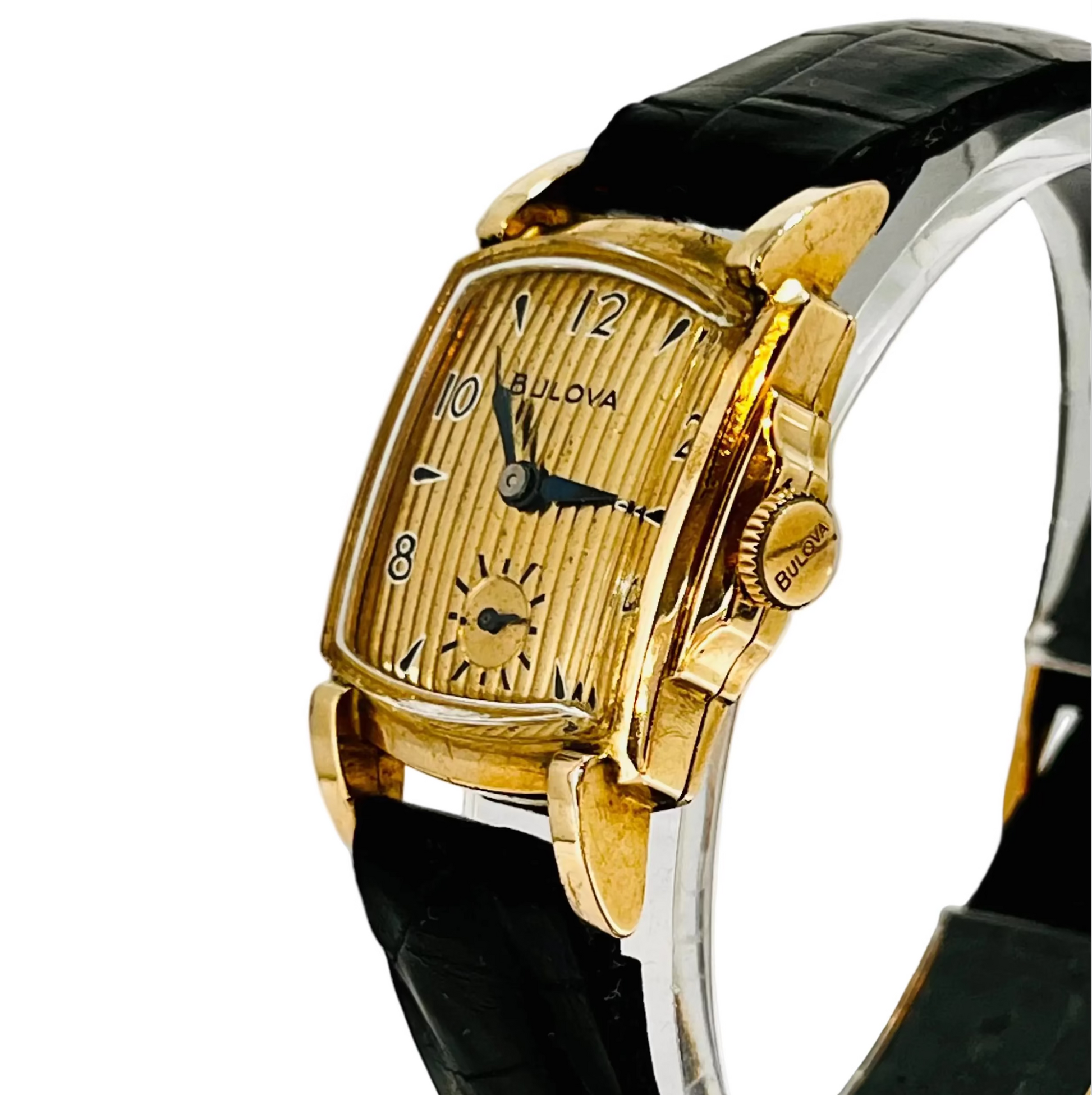 A Bulova Academy Award Z watch with a gold-filled rectangular case with Stepped sides and close up of original Bulova crown